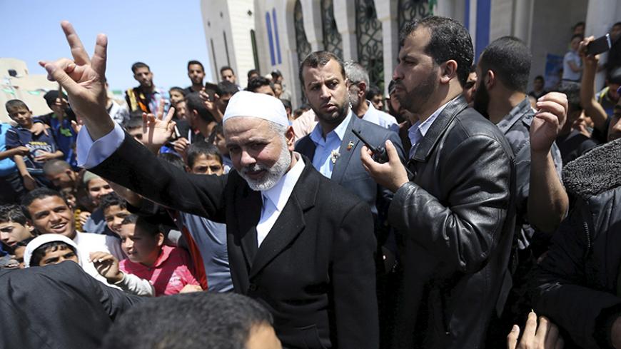Senior Hamas leader Ismail Haniyeh waves to people after attending Friday prayers at Tebah mosque in Rafah in the southern Gaza Strip May 1, 2015. REUTERS/Ibraheem Abu Mustafa - RTX1B4H7