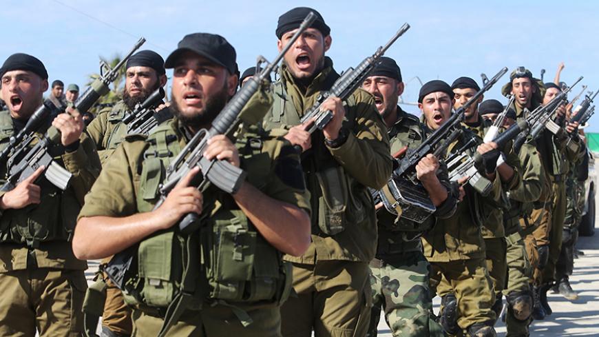 Members of Palestinian security forces loyal to Hamas march during a graduation ceremony in Gaza City January 10, 2016. REUTERS/Ibraheem Abu Mustafa  - RTX21Q8C