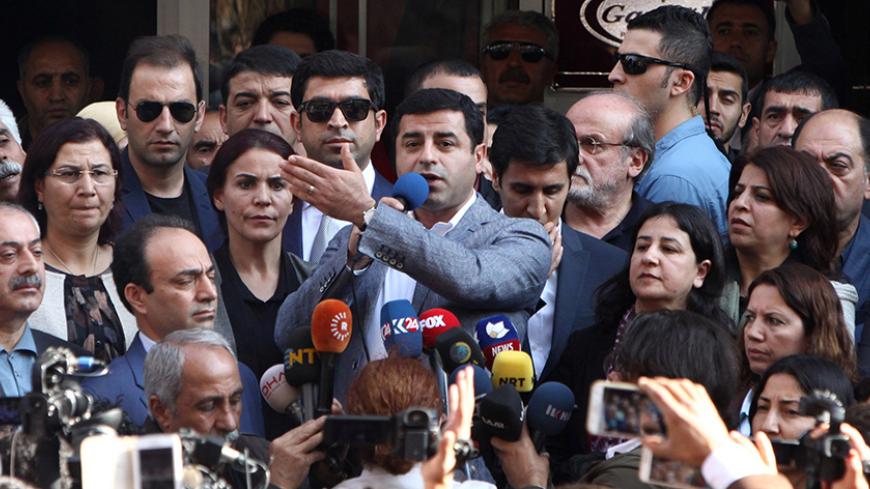Selahattin Demirtas, co-leader of the pro-Kurdish Peoples' Democratic Party (HDP), talks during a gathering to protest against the arrest of the city's popular two joint mayors for alleged links to terrorism, in the southeastern city of Diyarbakir, Turkey, October 27, 2016. REUTERS/Sertac Kayar - RTX2QPFF