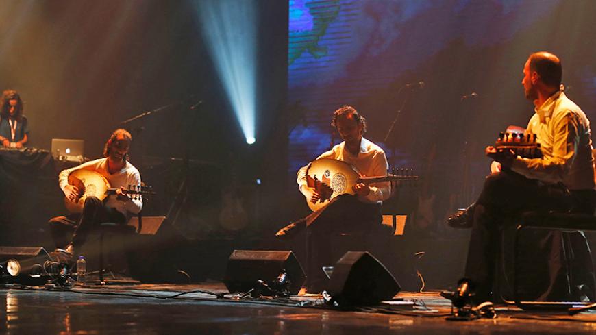 Palestinan oud band "Le Trio Joubran" perform on stage during a Guinness World Record attempt at the Ramallah Cultural Centre in the West Bank city of Ramallah on October 26, 2016.
The band will play their ouds for 12 hours without any break to draw attention to breast cancer and to set a Guinness World Record / AFP / ABBAS MOMANI        (Photo credit should read ABBAS MOMANI/AFP/Getty Images)