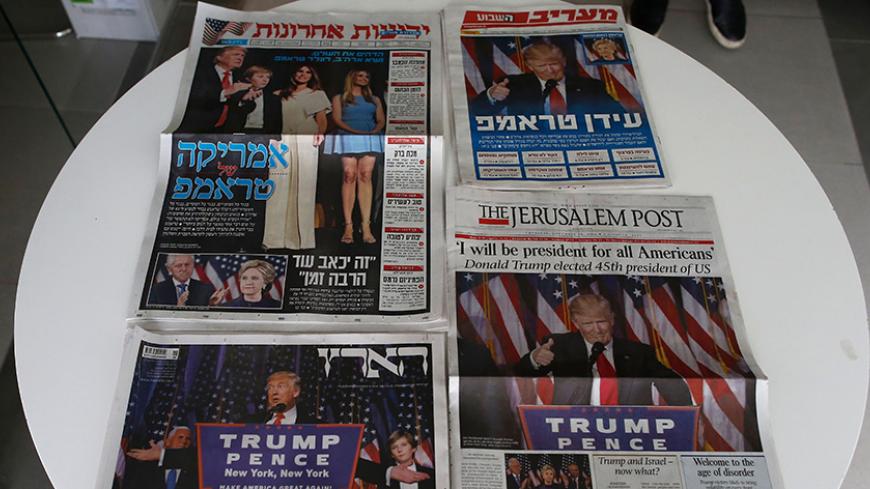 A picture taken on November 10, 2016 shows the frontpages of Israeli newspapers bearing images of US president-elect Donald Trump, with some of them showing his family members and contrasted with rival Hillary Clinton and her husband former President Bill Clinton, in Jerusalem.
Donald Trump's shock election as president will likely result in a US tilt towards Israel that puts a Palestinian state even further out of reach, his own campaign team and analysts say. / AFP / AHMAD GHARABLI        (Photo credit sh