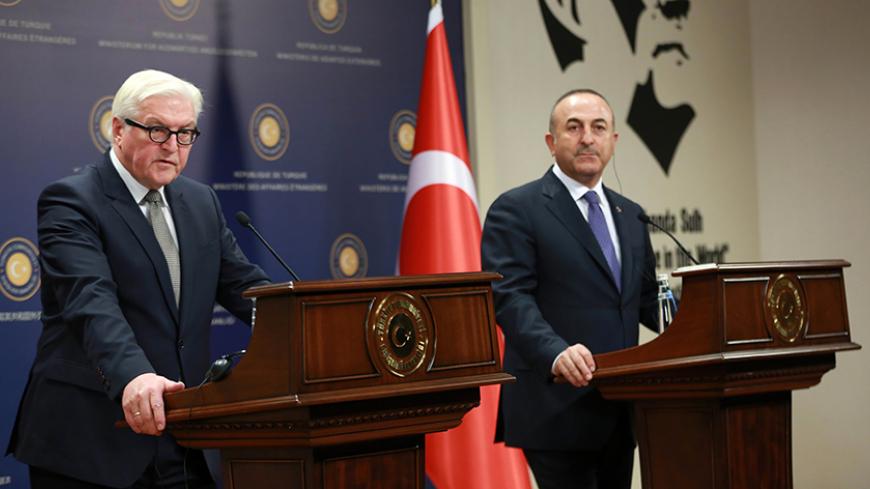 Turkish Foreign Minister Mevlut Cavusoglu (R) and his German counterpart Frank-Walter Steinmeier (L) give a press conference following their meeting at the Foreign Ministry in Ankara on November 15, 2016.  / AFP / ADEM ALTAN        (Photo credit should read ADEM ALTAN/AFP/Getty Images)