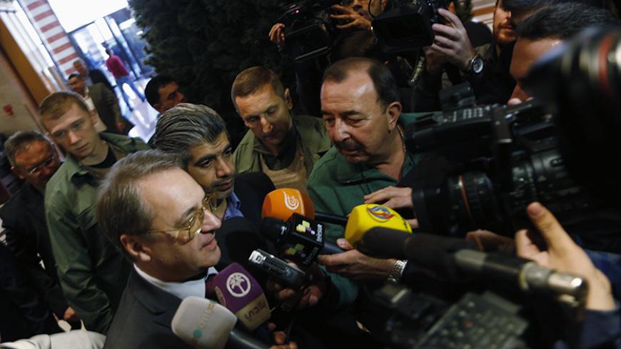 Russia's Deputy Foreign Minister Mikhail Bogdanov speaks to journalists upon his arrival in Damascus December 10, 2014. REUTERS/Omar Sanadiki (SYRIA - Tags: POLITICS) - RTR4HF01