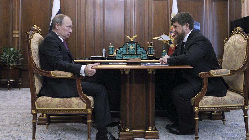 Russian President Vladimir Putin (L) meets with Chechnya's leader Ramzan Kadyrov at the Kremlin in Moscow, Russia, March 25, 2016. REUTERS/Mikhail Klimentyev/Sputnik/Kremlin ATTENTION EDITORS - THIS IMAGE HAS BEEN SUPPLIED BY A THIRD PARTY. IT IS DISTRIBUTED, EXACTLY AS RECEIVED BY REUTERS, AS A SERVICE TO CLIENTS. - RTSC7SC