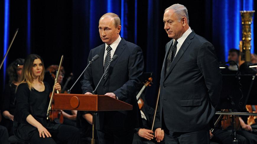 Russian President Vladimir Putin (L) and Israeli Prime Minister Benjamin Netanyahu attend a concert, dedicated to the 25th anniversary of the restoration of diplomatic relations between the two countries at the Bolshoi Theatre in Moscow, June 7, 2016. Sputnik/Kremlin/Mikhail Klimentyev/via REUTERS ATTENTION EDITORS - THIS IMAGE WAS PROVIDED BY A THIRD PARTY. EDITORIAL USE ONLY. - RTSGGFA