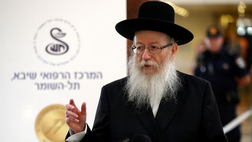 Israeli Health Minister Yaakov Litzman speaks during a briefing to members of the media on the medical condition of former Israeli President Shimon Peres a day after he suffered a stroke, at a hospital near Tel Aviv, Israel September 14, 2016. REUTERS/Baz Ratner - RTSNPU9