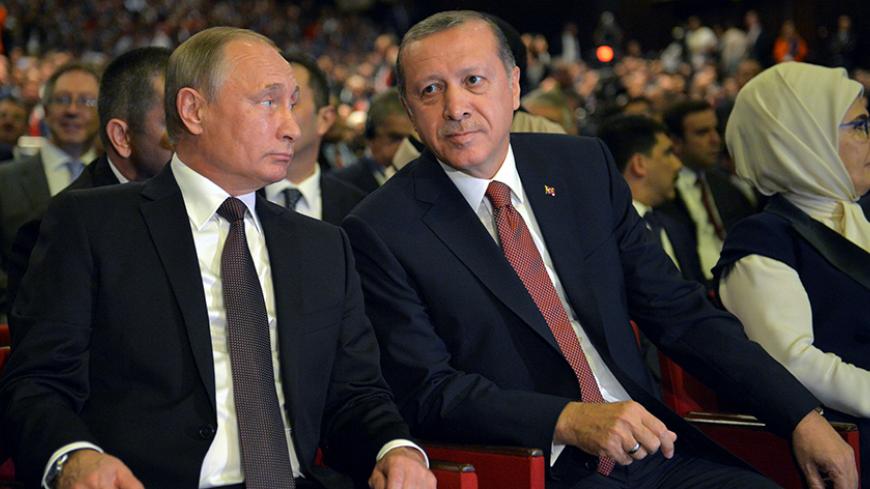 Russian President Vladimir Putin (L) and Turkish President Tayyip Erdogan attend a session of the World Energy Congress in Istanbul, Turkey, October 10, 2016. Sputnik/Kremlin/Alexei Druzhinin via REUTERS ATTENTION EDITORS - THIS IMAGE WAS PROVIDED BY A THIRD PARTY. EDITORIAL USE ONLY. - RTSRLXH