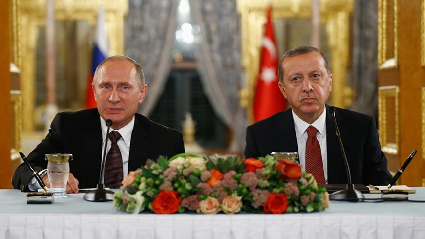 Russian President Vladimir Putin (L) talks during a joint news conference with his Turkish counterpart Tayyip Erdogan following their meeting in Istanbul, Turkey, October 10, 2016. REUTERS/Osman Orsal - RTSRNKN