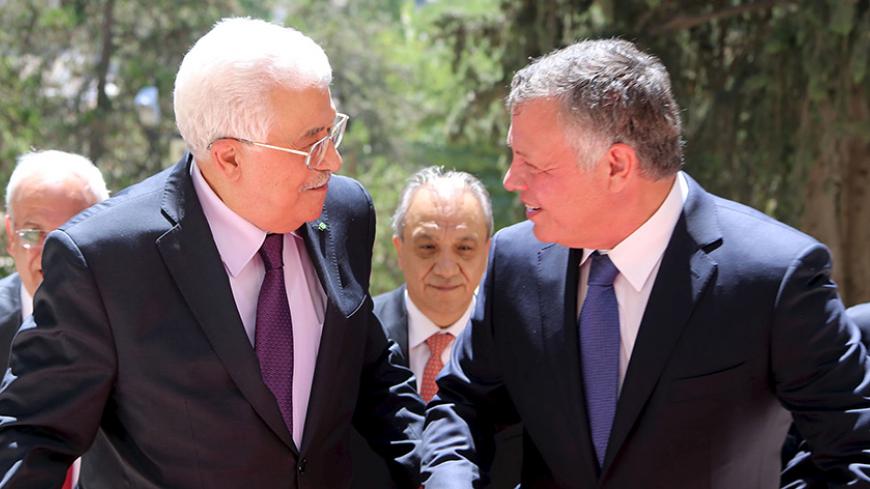 Jordan's King Abdullah (R) welcomes Palestinian President Mahmoud Abbas at the Royal Palace in Amman, Jordan, August 30, 2015 in this handout photo provided by Royal Palace. REUTERS/Yousef Allan/Royal Palace/Handout via ReutersATTENTION EDITORS - THIS PICTURE WAS PROVIDED BY A THIRD PARTY. REUTERS IS UNABLE TO INDEPENDENTLY VERIFY THE AUTHENTICITY, CONTENT, LOCATION OR DATE OF THIS IMAGE. FOR EDITORIAL USE ONLY. NOT FOR SALE FOR MARKETING OR ADVERTISING CAMPAIGNS. THIS PICTURE IS DISTRIBUTED EXACTLY AS RECE