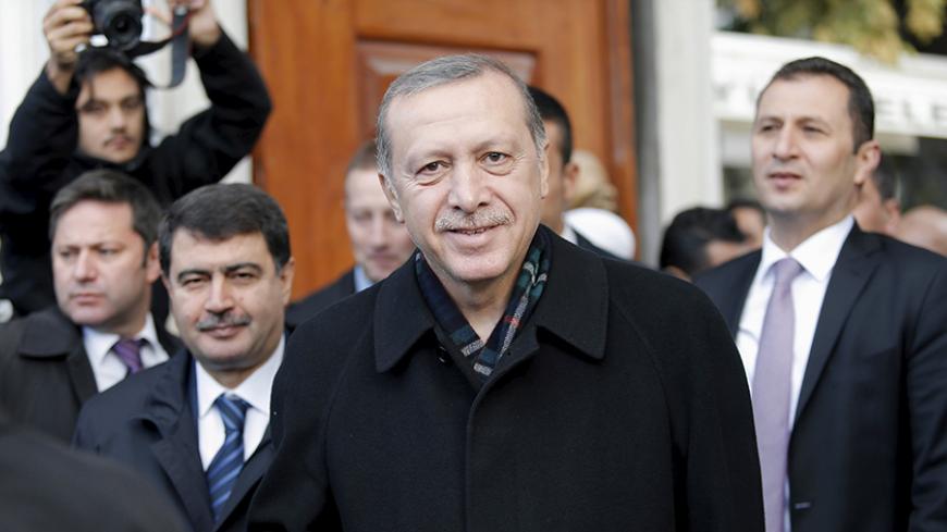 Turkish President Tayyip Erdogan smiles as he leaves from Eyup Sultan mosque in Istanbul, Turkey, November 2, 2015. President Erdogan said on Monday the nation had voted for stability in a parliamentary election that saw the AK Party he founded win almost 50 percent of the vote, and said the world should respect the result. The Islamist-rooted AKP swept to an unexpected landslide victory on Sunday, returning Turkey to single-party rule in an outcome that will boost Erdogan's power but may deepen social divi