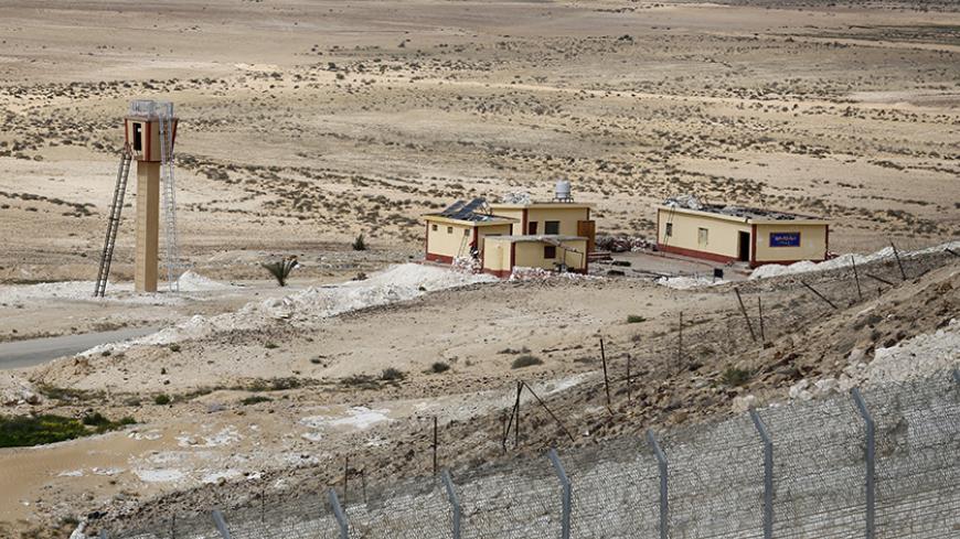 An Egyptian border post is seen from the Israeli side of the border fence with Egypt's Sinai peninsula, in Israel's Negev Desert February 10, 2016. REUTERS/Amir Cohen  - RTX26CIH