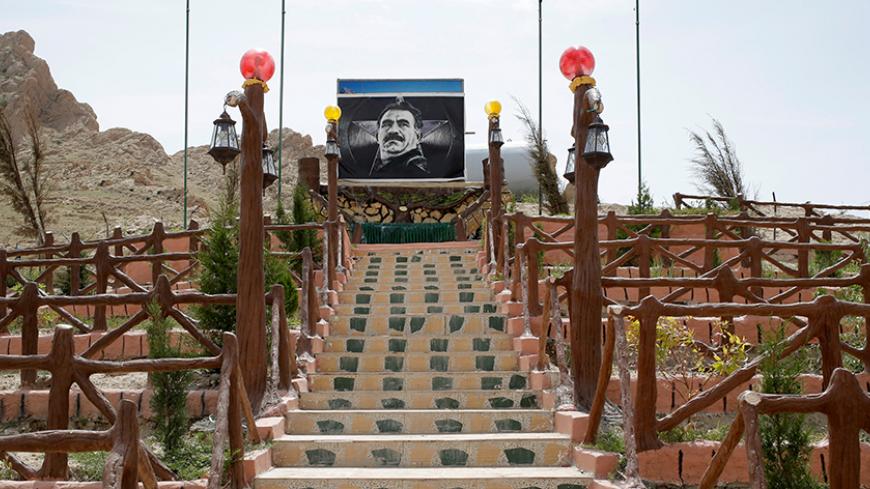 A picture of jailed Kurdistan Workers’ Party (PKK) leader Abdullah Ocalan is seen in a PKK mausoleum in Sinjar region, northern Iraq, May 1, 2016. They share little more than an enemy and struggle to communicate on the battlefield, but together two relatively obscure groups have opened up a new front against Islamic State militants in a remote corner of Iraq. The unlikely alliance between the Sinjar Resistance Units, an offshoot of a leftist Kurdish organisation, and Abdulkhaleq al-Jarba, a Arab tribal mili