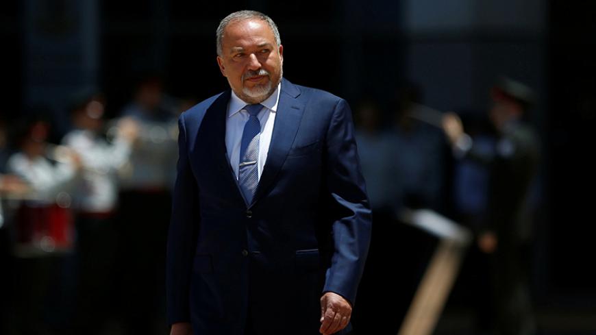 Israel's new Defence Minister, Avigdor Lieberman, head of far-right Yisrael Beitenu party, reviews an honour guard during a welcoming ceremony at the Defence Ministry in Tel Aviv, Israel May 31, 2016. REUTERS/Ronen Zvulun - RTX2EXRI