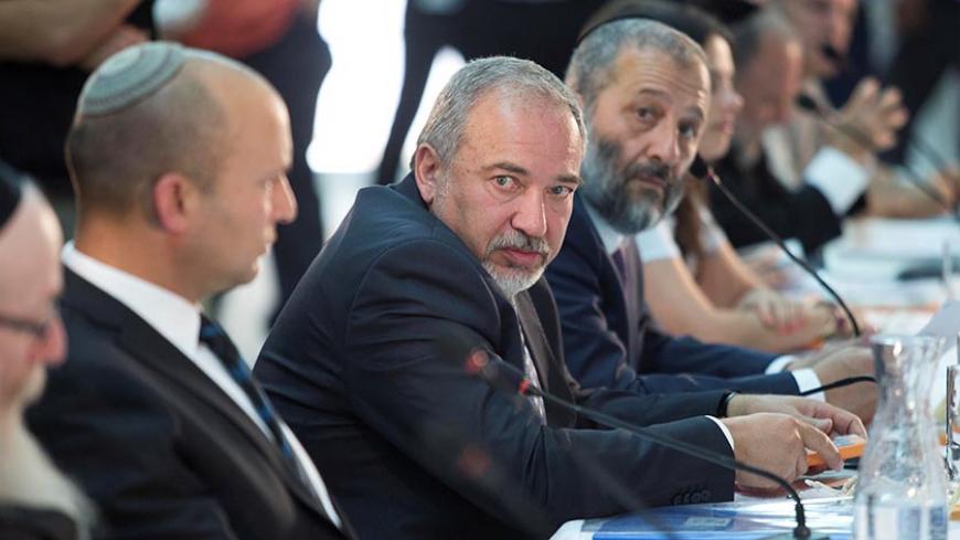 Israel defense minister, Avigdor Lieberman (C) during a special Cabinet meeting to mark Jerusalem Day in Ein Lavan spring located in the  outskirts of Jerusalem ,02 June 2016. REUTERS/Abir Sultan/Pool - RTX2FADS