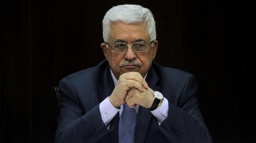 Palestinian President Mahmoud Abbas heads a Palestinian cabinet meeting in the West Bank city of Ramallah July 28, 2013. REUTERS/Issam Rimawi/Pool/File Photo - RTX2O7X6
