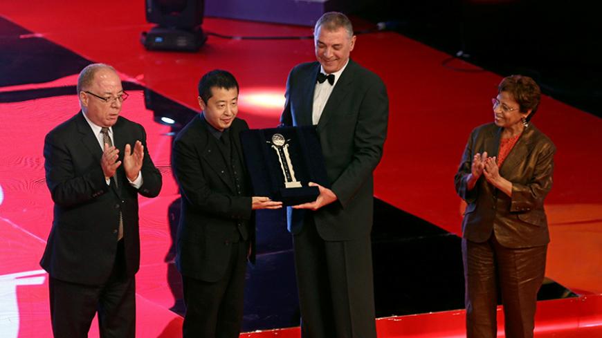 Chinese director Jia Zhangke receives the Faten Hamama Excellence Award during the opening ceremony of the 38th Cairo International Film Festival (CIFF), in Cairo, Egypt, November 15, 2016. Picture taken November 15, 2016. REUTERS/Mohamed Abd El Ghany - RTX2TXRT