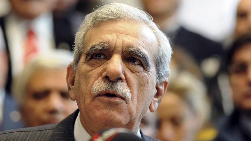 Democratic Society Party (DTP) leader Ahmet Turk, who was banned from politics for five years, attends a news conference in Ankara December 18, 2009. Deputies from Turkey's main pro-Kurdish party decided to stay in parliament despite a court decision to ban their movement, its banned leader said on Friday, removing a potential source of political instability. REUTERS/Stringer (TURKEY - Tags: POLITICS) - RTXRZ8Y