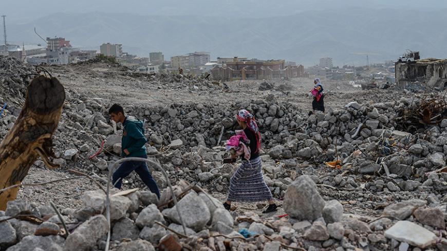 People arrive at Sirnak city on November 14, 2016  after a 246-day curfew was partially lifted. 
The curfew in Sirnak, a city of 290,000, was imposed on March 14 as part of operations to eradicate the PKK from eastern Turkey. / AFP / ILYAS AKENGIN        (Photo credit should read ILYAS AKENGIN/AFP/Getty Images)