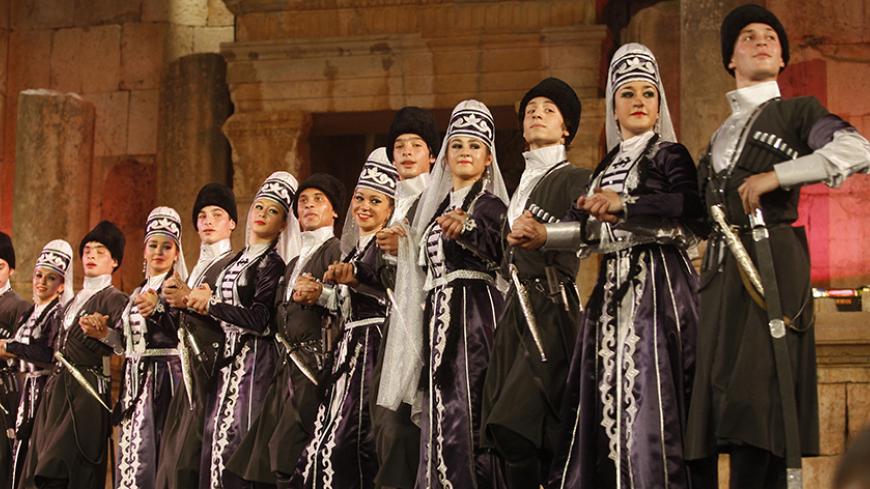 Dancers from the Circassian minority perform dances from their old folklore heritage at the Southern theatre during the Jerash Festival in the ancient city of Jerash July 26, 2011. The Jerash festival for culture and art is a celebration of both Jordanian and international culture featuring poetry recitals, gymnastic performances, dance, plays and comedy. Picture taken July 26, 2011. REUTERS/Stringer (JORDAN - Tags: ENTERTAINMENT) - RTR2PC4Q