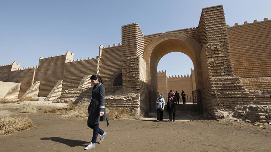 Residents visit the ancient city of Babylon near Hilla, 100 km (62 miles) south of Baghdad February 17, 2012. Picture taken February 17, 2012. REUTERS/Mohammed Ameen (IRAQ - Tags: TRAVEL SOCIETY) - RTR2Y1RF