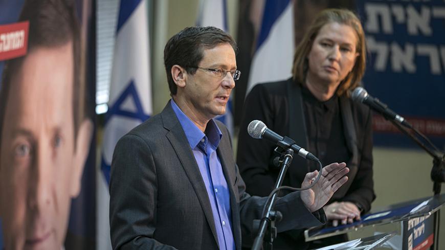 Tzipi Livni (R) and Isaac Herzog, heads of the centrist Zionist Union party, hold a news conference in Tel Aviv to introduce their party's platform for the March 17 election, March 8, 2015. REUTERS/Baz Ratner (ISRAEL - Tags: POLITICS ELECTIONS) - RTR4SIUR