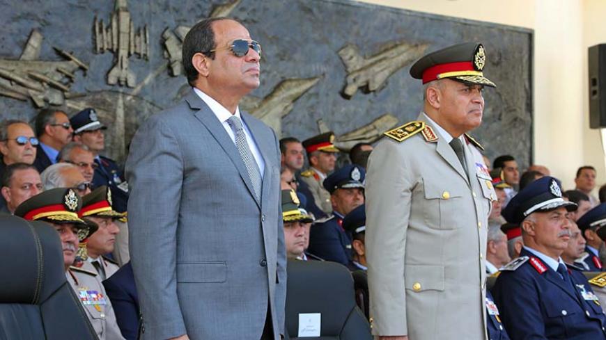 Egyptian President Abdel Fattah al-Sisi (L) and Egypt's Defense Minister Sedki Sobhi attend the graduation of 83 aviation and military science at the Air Force Academy in Cairo, Egypt July 20, 2016 in this handout picture courtesy of the Egyptian Presidency. The Egyptian Presidency/Handout via REUTERS ATTENTION EDITORS - THIS IMAGE WAS PROVIDED BY A THIRD PARTY. EDITORIAL USE ONLY. - RTSIXH4