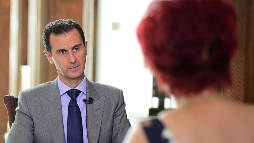 Syria's President Bashar al-Assad speaks during an interview with Russian tabloid Komsomolskaya Pravda, in this handout picture provided by SANA on October 14, 2016. SANA/Handout via REUTERS ATTENTION EDITORS - THIS PICTURE WAS PROVIDED BY A THIRD PARTY. REUTERS IS UNABLE TO INDEPENDENTLY VERIFY THE AUTHENTICITY, CONTENT, LOCATION OR DATE OF THIS IMAGE. FOR EDITORIAL USE ONLY.     TPX IMAGES OF THE DAY      - RTSS7BS