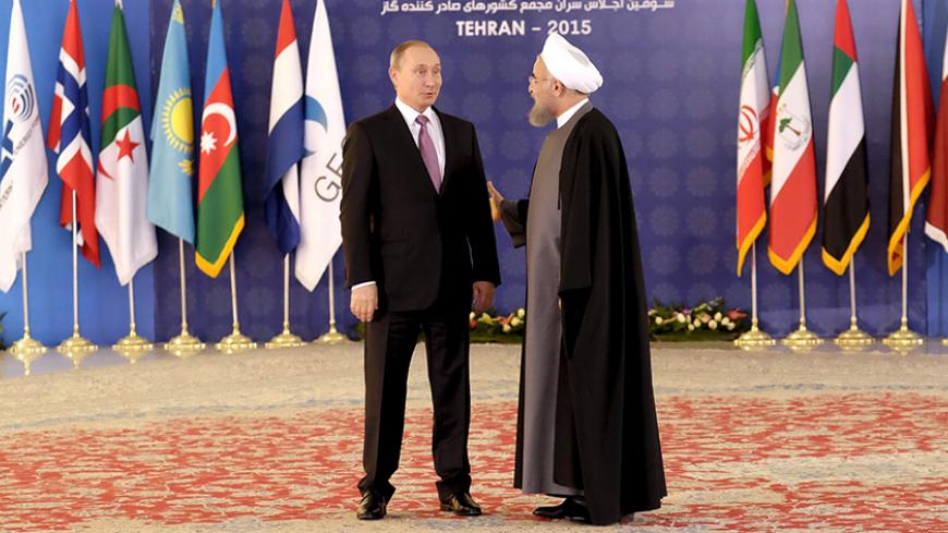 Iran's President Hassan Rouhani (R) welcomes Russia's President Vladimir Putin during the Gas Exporting Countries Forum (GECF) in Tehran, Iran, November 23, 2015. REUTERS/Raheb Homavandi/TIMA  ATTENTION EDITORS - THIS IMAGE WAS PROVIDED BY A THIRD PARTY. FOR EDITORIAL USE ONLY.  - RTX1VGAC