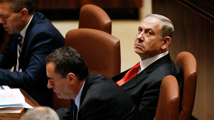 Israeli Prime Minister Benjamin Netanyahu (R) attends a preliminary vote on a bill at the Knesset, the Israeli parliament, in Jerusalem November 16, 2016. REUTERS/Ammar Awad - RTX2TXXZ