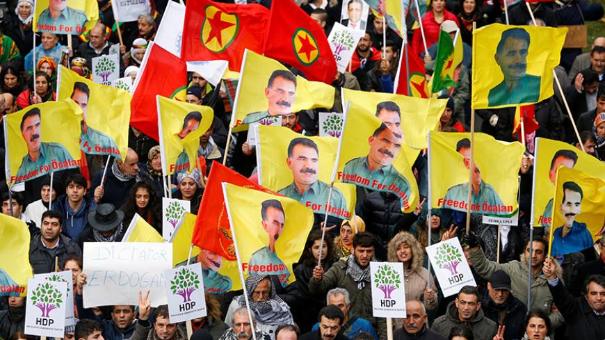 Protesters hold flags showing jailed PKK leader (Kurdistan Workers' Party) Abdullah Ocalan during a demonstration against Turkish President Tayyip Erdogan in central Brussels, Belgium, November 17, 2016. REUTERS/Yves Herman - RTX2U3V0