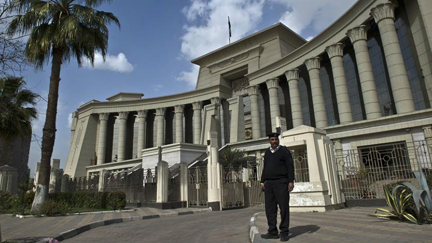 An Egyptian policeman stands guard outside the Supreme Constitutional Court in Cairo on February 25, 2015 during a court session to determine if the House of Representatives parliamentary election law is constitutional. Egypt's Constitutional Court said it will rule on March 1 whether the country's election law is constitutional, a verdict that could alter the schedule of the upcoming parliamentary polls. AFP PHOTO / KHALED DESOUKI        (Photo credit should read KHALED DESOUKI/AFP/Getty Images)