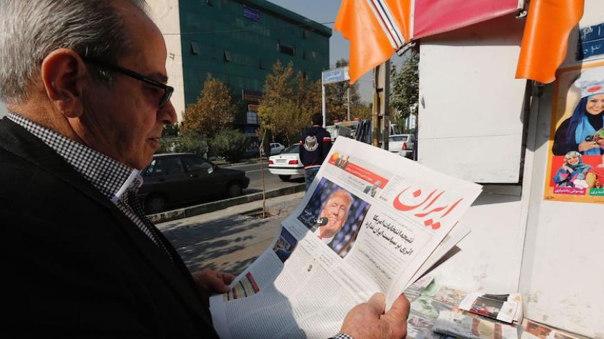 An Iranian man holds a local newspaper displaying a portrait of Donald Trump a day after his election as the new US president, in the capital Tehran, on November 10, 2016.
Iran's President Hassan Rouhani said on November 9 there was "no possibility" of its nuclear deal with world powers being overturned by US president-elect Donald Trump despite his threat to rip it up.

 / AFP / ATTA KENARE        (Photo credit should read ATTA KENARE/AFP/Getty Images)