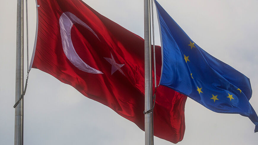 ISTANBUL, TURKEY - NOVEMBER 24:  An EU and Turkish National flag are seen outside a shopping mall on November 24, 2016 in Istanbul, Turkey.  European Parliament today voted to suspend Turkey's EU membership talks. Turkey's President Recep Tayyip Erdogan said the decision " has no value for us." The Turkish Lira has weakened significantly since the July 15th failed coup attempt forcing Turkey's central bank today to raise interest rates for the first time in nearly three years.  (Photo by Chris McGrath/Getty