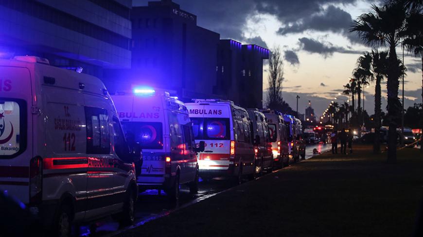 Ambulances are parked next to the site of an explosion in front of the courthouse in Izmir on January 5, 2017. 
A car bombing rocked the Turkish city of Izmir on January 5, 2016, killing at least two people and triggering a shootout that left two suspected militants dead, as authorities chased the fugitive killer behind the New Year attack in Istanbul. / AFP / EMRE TAZEGUL        (Photo credit should read EMRE TAZEGUL/AFP/Getty Images)