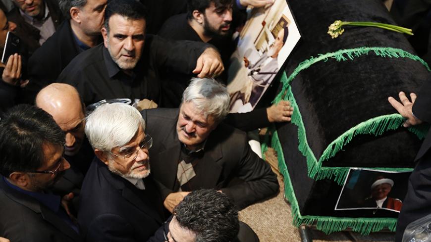 Iranian leading reformist member of parliament Mohammad Reza Aref (2L) attends a mourning ceremony for former Iranian president Akbar Hashemi Rafsanjani at the Jamaran mosque in Tehran on January 9, 2017.
Rafsanjani died in hospital on January 8 after suffering a heart attack. Rafsanjani, who was 82, was a pivotal figure in the foundation of the Islamic republic in 1979, and served as president from 1989 to 1997. / AFP / ATTA KENARE        (Photo credit should read ATTA KENARE/AFP/Getty Images)