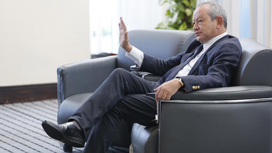 Egyptian billionaire Naguib Sawiris speaks during an interview with Reuters in Sharm el-Sheikh, in the South Sinai governorate, south of Cairo, March 15, 2015. Sawiris said he was ready to invest $500 million in Egypt and was diversifying his telecoms business into infrastructure, energy and transportation, sectors which need major funds in the country. REUTERS/Amr Abdallah Dalsh  (EGYPT - Tags: BUSINESS POLITICS) - RTR4TF9Q