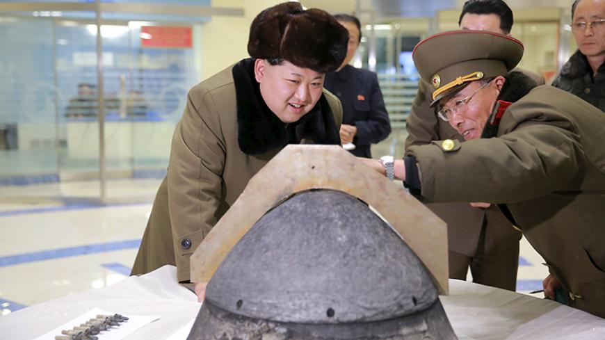 North Korean leader Kim Jong Un looks at a rocket warhead tip after a simulated test of atmospheric re-entry of a ballistic missile, at an unidentified location in this undated photo released by North Korea's Korean Central News Agency (KCNA) in Pyongyang on March 15, 2016.     REUTERS/KCNA ATTENTION EDITORS - THIS PICTURE WAS PROVIDED BY A THIRD PARTY. REUTERS IS UNABLE TO INDEPENDENTLY VERIFY THE AUTHENTICITY, CONTENT, LOCATION OR DATE OF THIS IMAGE. FOR EDITORIAL USE ONLY. NOT FOR SALE FOR MARKETING OR A