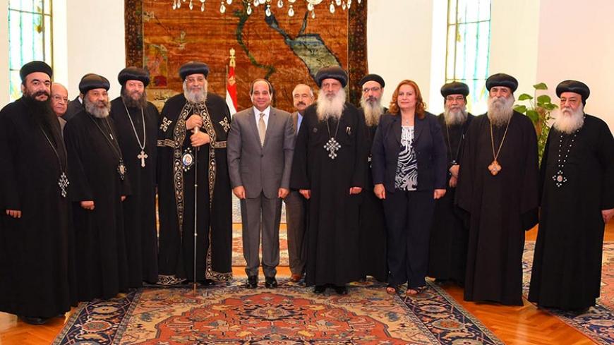 Egyptian President Abdel Fattah al-Sisi attends a meeting with Egyptian Coptic Pope Tawadros II, head of the Egyptian Coptic Orthodox Church, with some members of the Holy Synod of the Coptic Orthodox Church at the Ittihadiya presidential palace in Cairo, Egypt July 28, 2016 in this handout picture courtesy of the Egyptian Presidency. The Egyptian Presidency/Handout via REUTERS ATTENTION EDITORS - THIS IMAGE WAS PROVIDED BY A THIRD PARTY. EDITORIAL USE ONLY. - RTSK39U