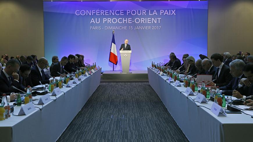 French Minister of Foreign Affairs Jean-Marc Ayrault addresses delegates at the opening of the Mideast peace conference in Paris, January 15, 2017.Around 70 countries and international organisations are making a new push for a two-state solution in the Middle East at the conference in Paris. REUTERS/Thomas Samson/POOL - RTSVKTN