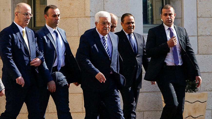 Palestinian President Mahmoud Abbas and Palestinian Prime Minister Rami Hamdallah (L) arrive to welcome Polish President Andrzej Duda (not seen) in the West Bank town of Bethlehem January 18, 2017.  REUTERS/Mussa Qawasma - RTSW268