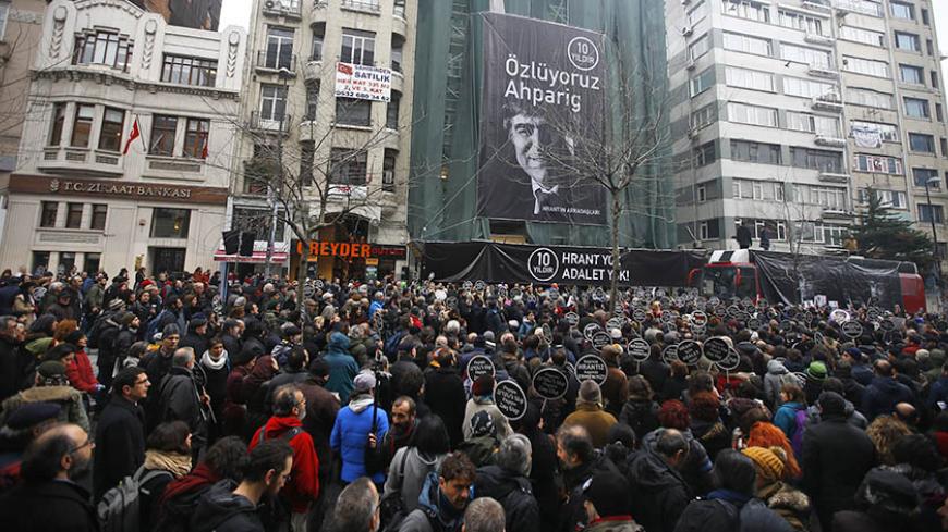 People gather on the spot, where Turkish-Armenian journalist Hrant Dink was killed, during a commemoration to mark the 10th anniversary of his death, in Istanbul, Turkey, January 19, 2017. REUTERS/Osman Orsal - RTSW8WH