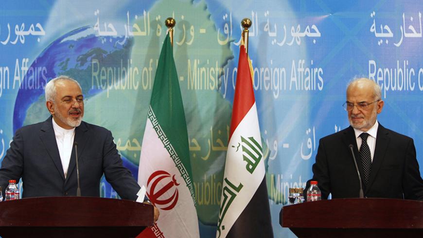Iranian Foreign Minister Mohammad Javad Zarif (L) speaks during a news conference with Iraqi Foreign Minister Ibrahim al-Jaafari in Baghdad, July 27, 2015. REUTERS/Ahmed Saad - RTX1M0DA