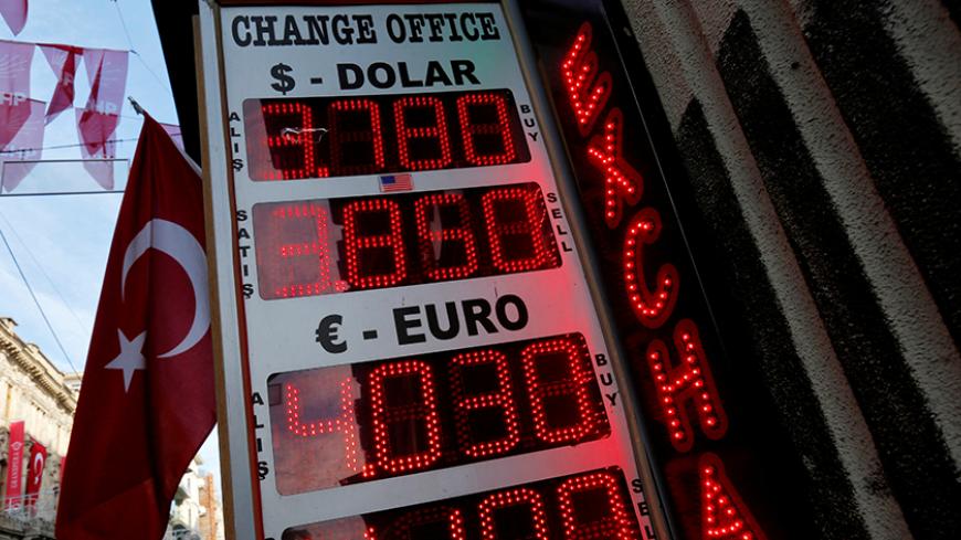 A board showing the currency exchange rates of the U.S. dollar and the Euro against Turkish lira is on display at a currency exchange office in central Istanbul, Turkey January 12, 2017. REUTERS/Murad Sezer - RTX2YN8E
