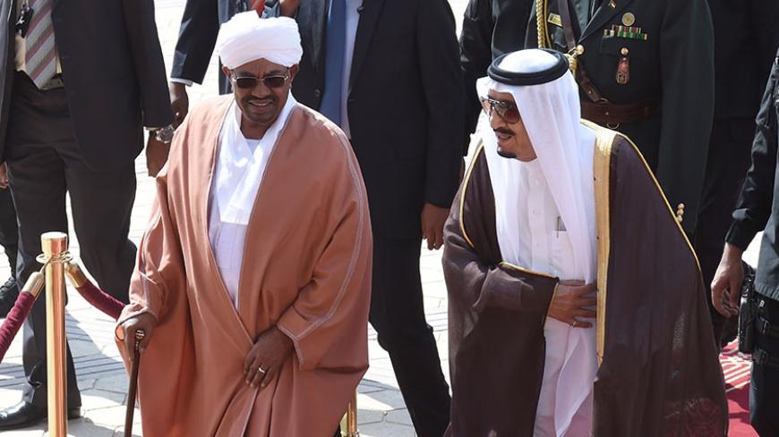 Saudi King Salman bin Abdulaziz (R) welcomes Sudanese President Omar al-Bashir at King Khalid International airport in Riyadh, on November 10, 2015. Arab leaders and top officials from South America are converging on Saudi Arabia for a summit aiming to strengthen ties between the geographically distant but economically powerful regions. AFP PHOTO / FAYEZ NURELDINE        (Photo credit should read FAYEZ NURELDINE/AFP/Getty Images)