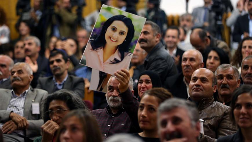 A supporter holds a portrait of Figen Yuksekdag, detained co-leader of Turkey's pro-Kurdish opposition Peoples' Democratic Party (HDP) at a meeting at the Turkish parliament in Ankara, on November 8, 2016.
The arrest of 10 of the HDP MPs, including party leaders Selahattin Demirtas and Figen Yuksekdag, added to tensions as Turkey wages a relentless battle against Kurdish militants and deals with the aftermath of a July 15 failed coup. / AFP / ADEM ALTAN        (Photo credit should read ADEM ALTAN/AFP/Getty 