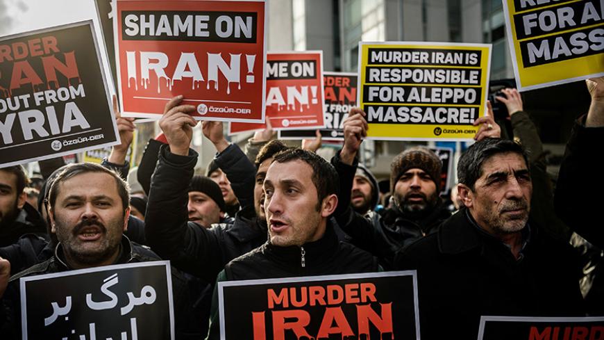 Protesters shout anti-Iran slogans and hold placards in front of the Iranian embassy on December 16, 2016, in Istanbul, during a demonstration against Iranian involvement in the siege of Aleppo, the latest in a series of demonstrations in Europe over the Syria crisis. 
Turkey has provided support to the Syrian opposition and repeatedly called for Assad to go. Protests have been staged in several European cities as the horror in Aleppo has unfolded, with reports of atrocities including summary executions.
 /