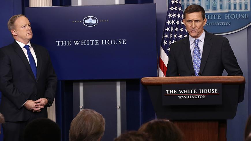 WASHINGTON, DC - FEBRUARY 01:  White House Press Secretary Sean Spicer (L) yields the briefing room podium to National Security Adviser Michael Flynn  February 1, 2017 in Washington, DC. Flynn said the White House is "officially putting Iran on notice" for a recent missile test and support for Houthi rebels in Yemen.  (Photo by Win McNamee/Getty Images)