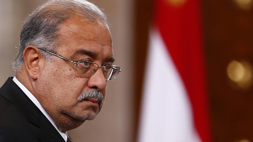 Ismail Sharif, Egyptian Minister of Petroleum and Mineral Resources, arrives to attend a news conference between Egypt's President Abdel Fattah al-Sisi with Cyprus' President Nicos Anastasiades and Greek Prime Minister Antonis Samaras after their summit at the presidential palace in Cairo November 8, 2014. Sisi is meeting with his Cypriot counterpart Nicos Anastasiades and Samaras as part of a tripartite summit for the leaders of the three countries to discuss cooperation in all areas and combating terroris