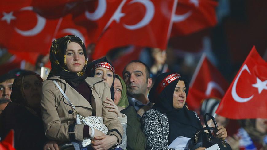 Supporters of the ruling AK Party wave Turkish flags during a campaign meeting for the April 16 constitutional referendum, in Ankara, Turkey, February 25, 2017. REUTERS/Umit Bektas - RTS108VN