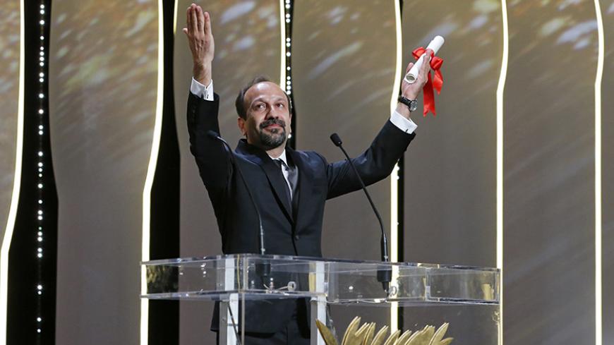 Director Asghar Farhadi, Best screenplay award winner for his film "Forushande" (The Salesman), reacts on stage during the closing ceremony of the 69th Cannes Film Festival in Cannes, France, May 22, 2016.            REUTERS/Yves Herman  TPX IMAGES OF THE DAY   - RTSFF3F
